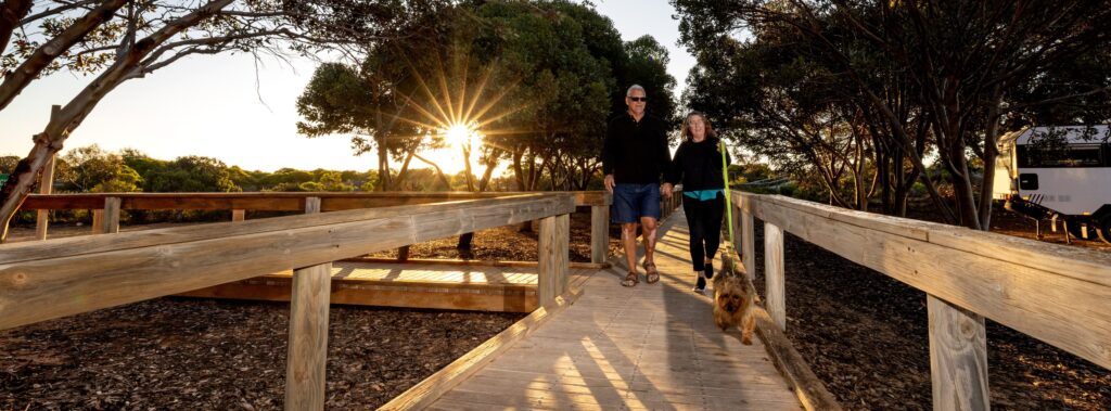 PH Couple with their Dog on the boardwalk